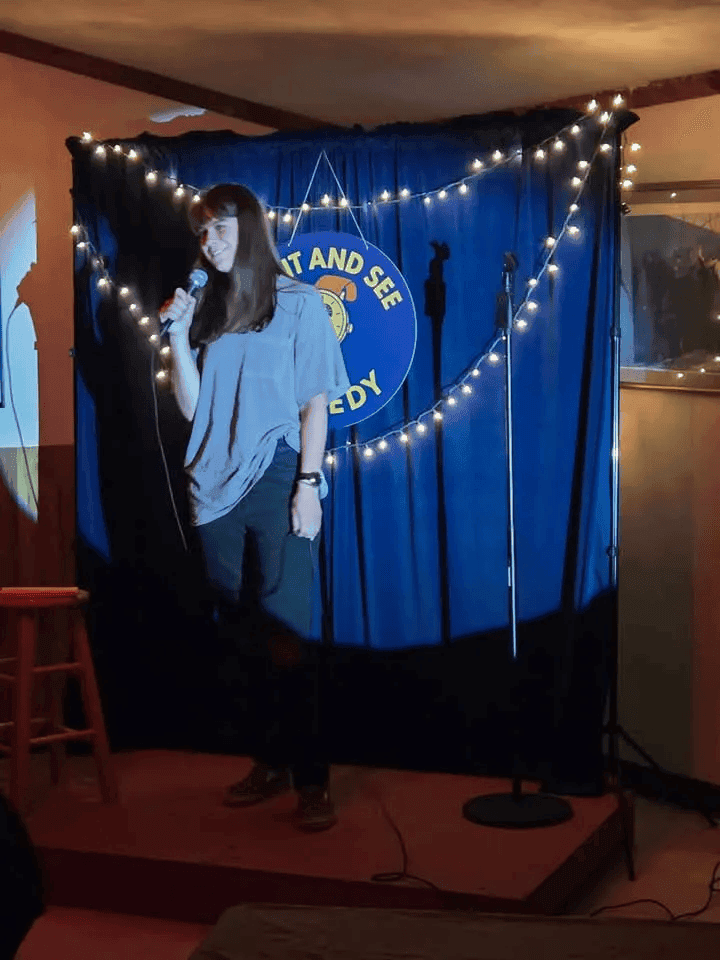 Comic performing at Wait And See Open Mic